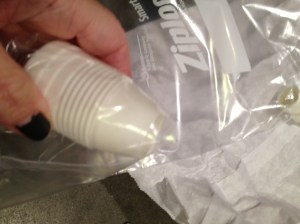 step 1: cut off 1 corner of the bag, place the large part of the coupler into the bag.